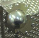 Zinc plated metal ball corner closeup